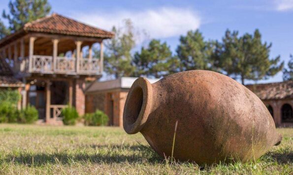 Traditional Georgian claypot qvevri in the yard of a family run small local winery marani