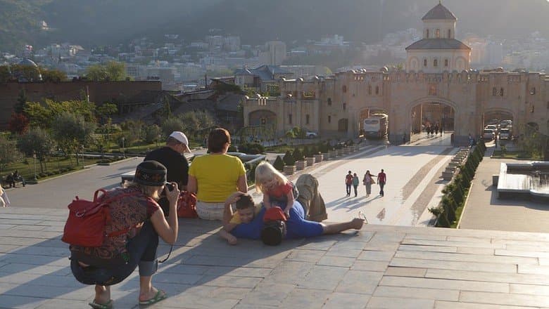 Small group tour travelers in Georgia taking picture inside the Sameba Cathedral in Tbilisi