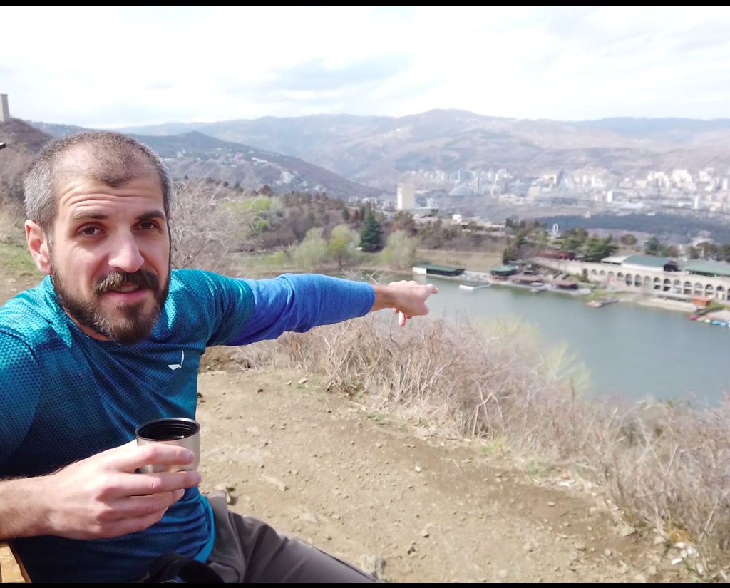 Guide Zviad pointing at Turtle lake in Tbilisi
