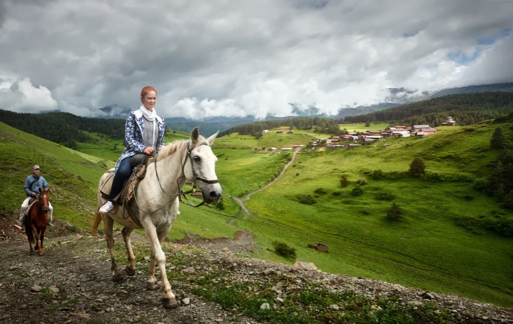 Woman on horse riding tours in Georgia